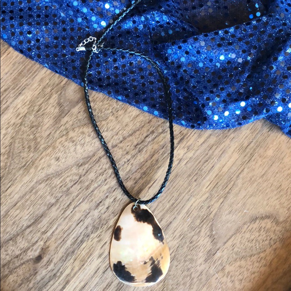 Mother of pearl pendant on leather chain